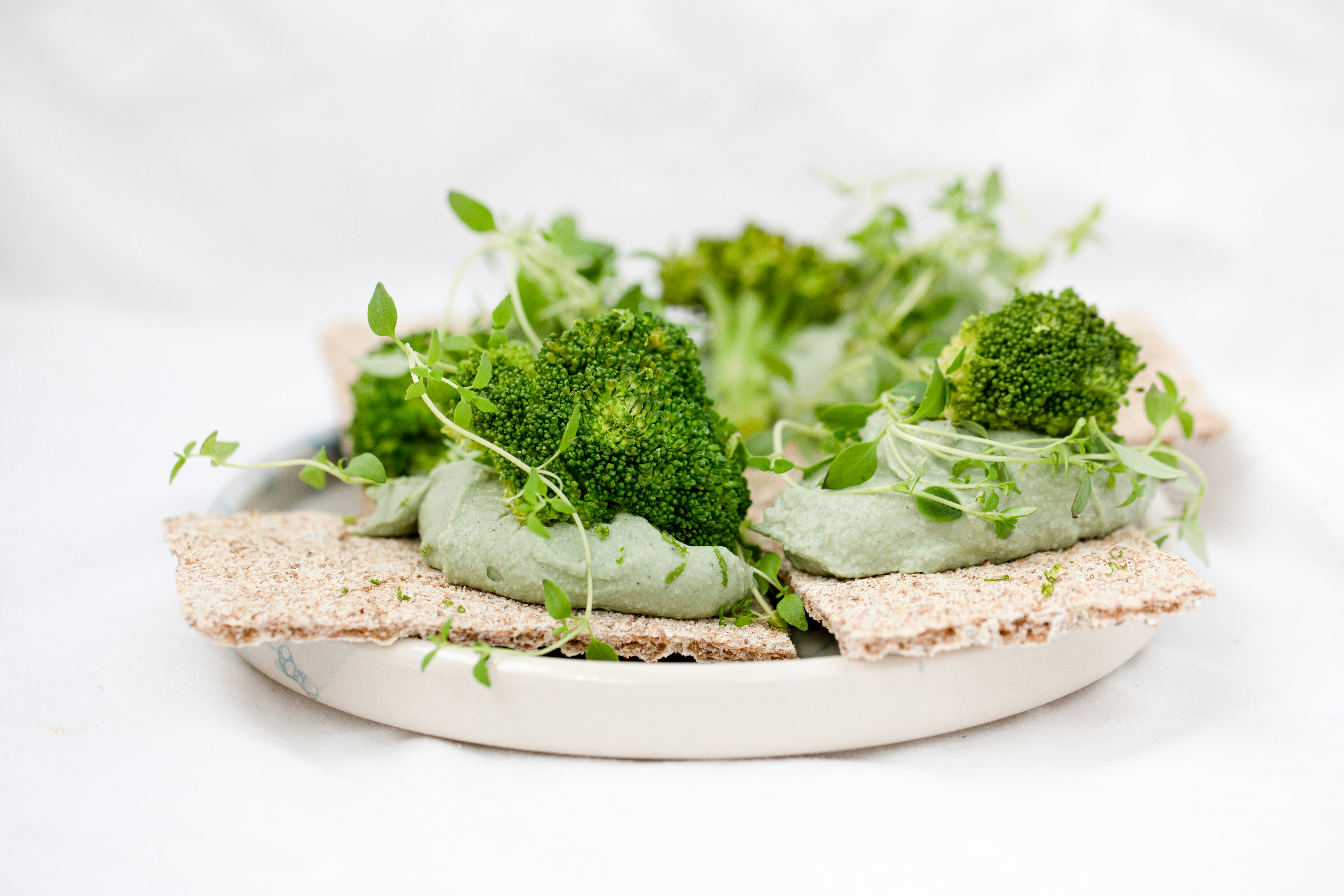 green vegetable on brown wooden round plate